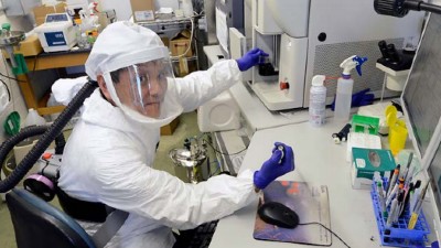 Yutaka working in the BSL3 lab