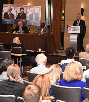 People speaking at a meeting